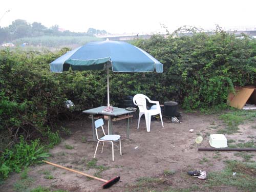 The Umbrella and table and chairs, abandoned